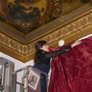 Caite Sofield installs fabric paneling in a gallery  (Courtesy of the Philadelphia Museum of Art by Jason Wierzbicki)