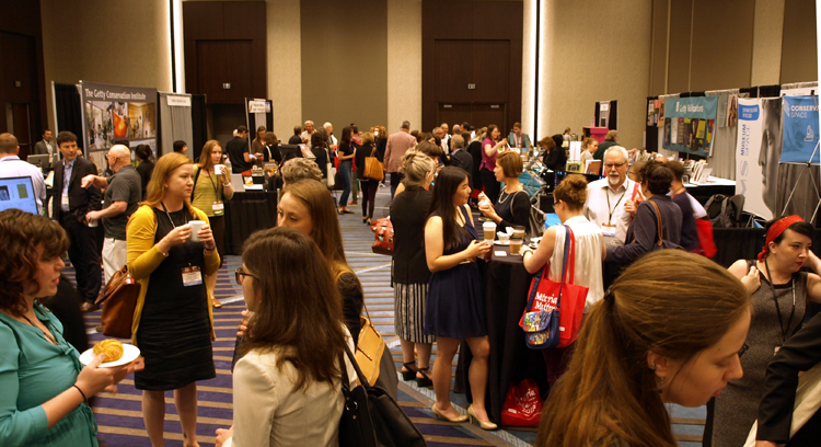 2018 Exhibit Hall with attendees mingling with exhibitors