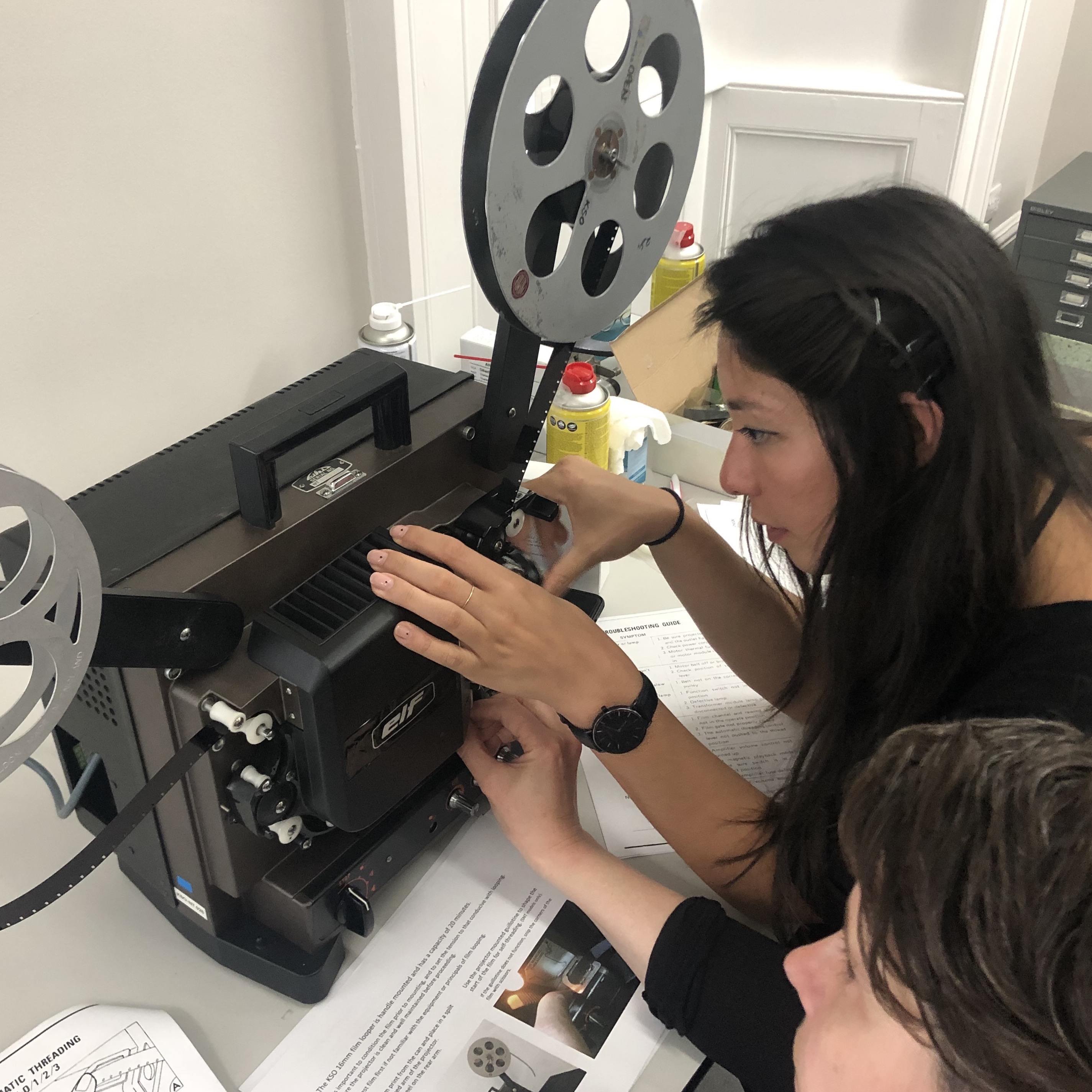 Taylor working on a projector